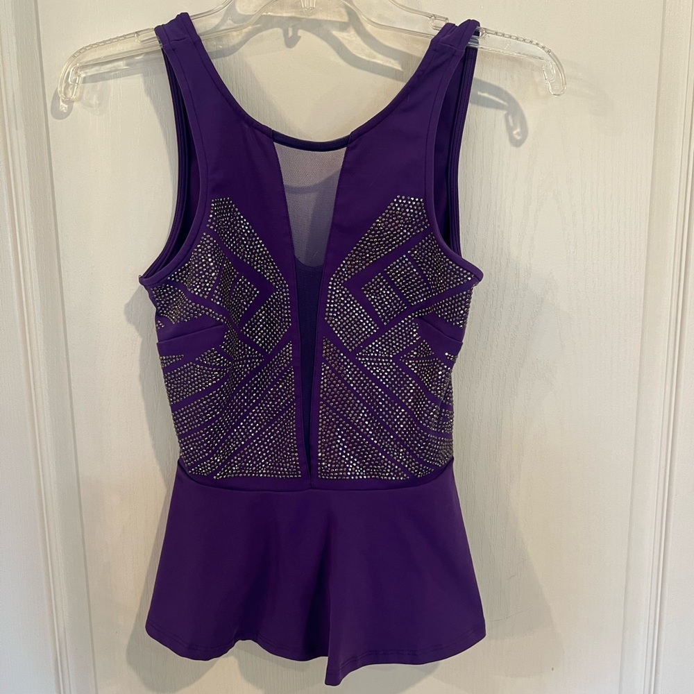 Bebe purple peplum top. Embellished with deep mesh v-neck. size small